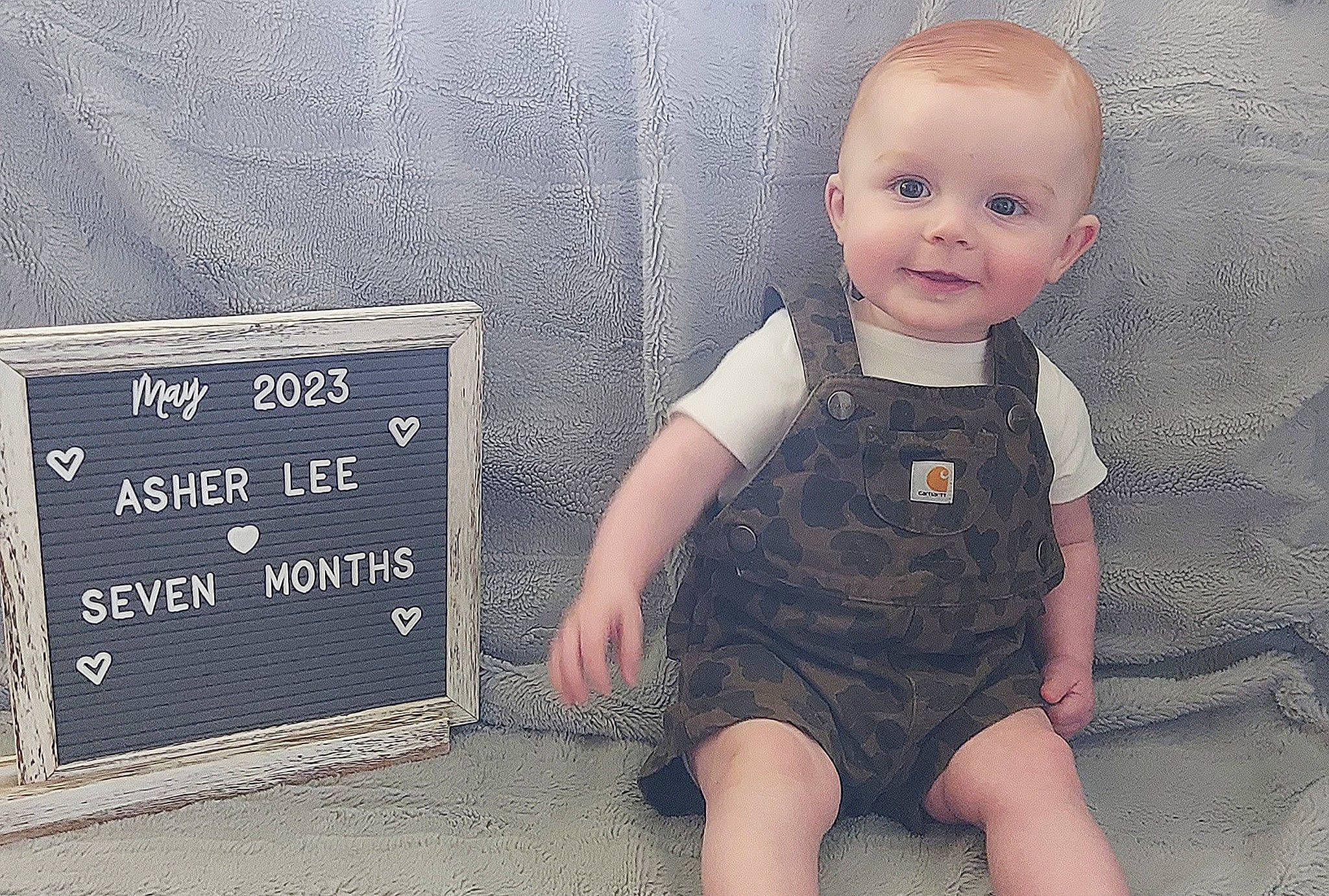 Asher joined the competition — help win amazing prizes! baby, baby_toddler_clothing, child, cool, facial_expression, flash_photography, flooring, font, grass, happy, joy, pattern, person, portrait_photography, product, sitting, skin, sleeve, smile, t_shirt