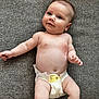 baby, infant, diaper, smile, face, skin, couch, fabric, texture, arm, leg, human, child, cute, relaxing, indoors, skin_tone, expression, comfort, lying_down