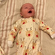 Hunter joined the competition — help win amazing prizes! baby, infant, onesie, reindeer_pattern, blanket, pacifier, smiling, happy, sleepwear, child, cute, lying_down, baby_clothes, cozy, indoor, soft_lighting, infant_garment, small_hands, peaceful, resting