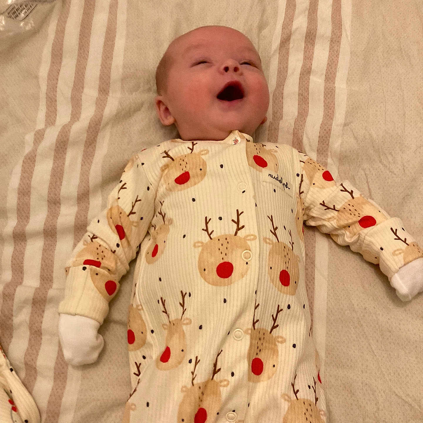 Hunter joined the competition — help win amazing prizes! baby, baby_clothes, blanket, child, cozy, cute, happy, indoor, infant, infant_garment, lying_down, onesie, pacifier, peaceful, reindeer_pattern, resting, sleepwear, small_hands, smiling, soft_lighting