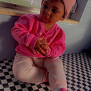 Akari joined the competition — help win amazing prizes! beanie, casual_clothing, checkered_floor, child, cozy, curly_hair, cute, daylight, expression, fashion, floor_pattern, hands_clasped, indoor, pink_shoes, pink_sweater, portrait, sitting, toddler, window, young_child