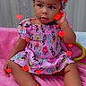 toddler, child, baby, pink_blanket, headband, mickey_mouse, dress, sitting, cute, indoors, portrait, face, feet, hand, curly_hair, expression, colorful, red_hearts, fabric, soft_texture