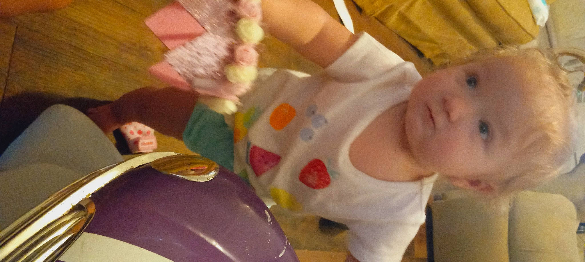 Harley is registered to the contest to win money with this photo: baby, baby_products, baby_toddler_clothing, child, finger, flooring, fun, hand, happy, leisure, motor_vehicle, mouth, nail, person, room, sitting, skin, t_shirt, thumb, toddler