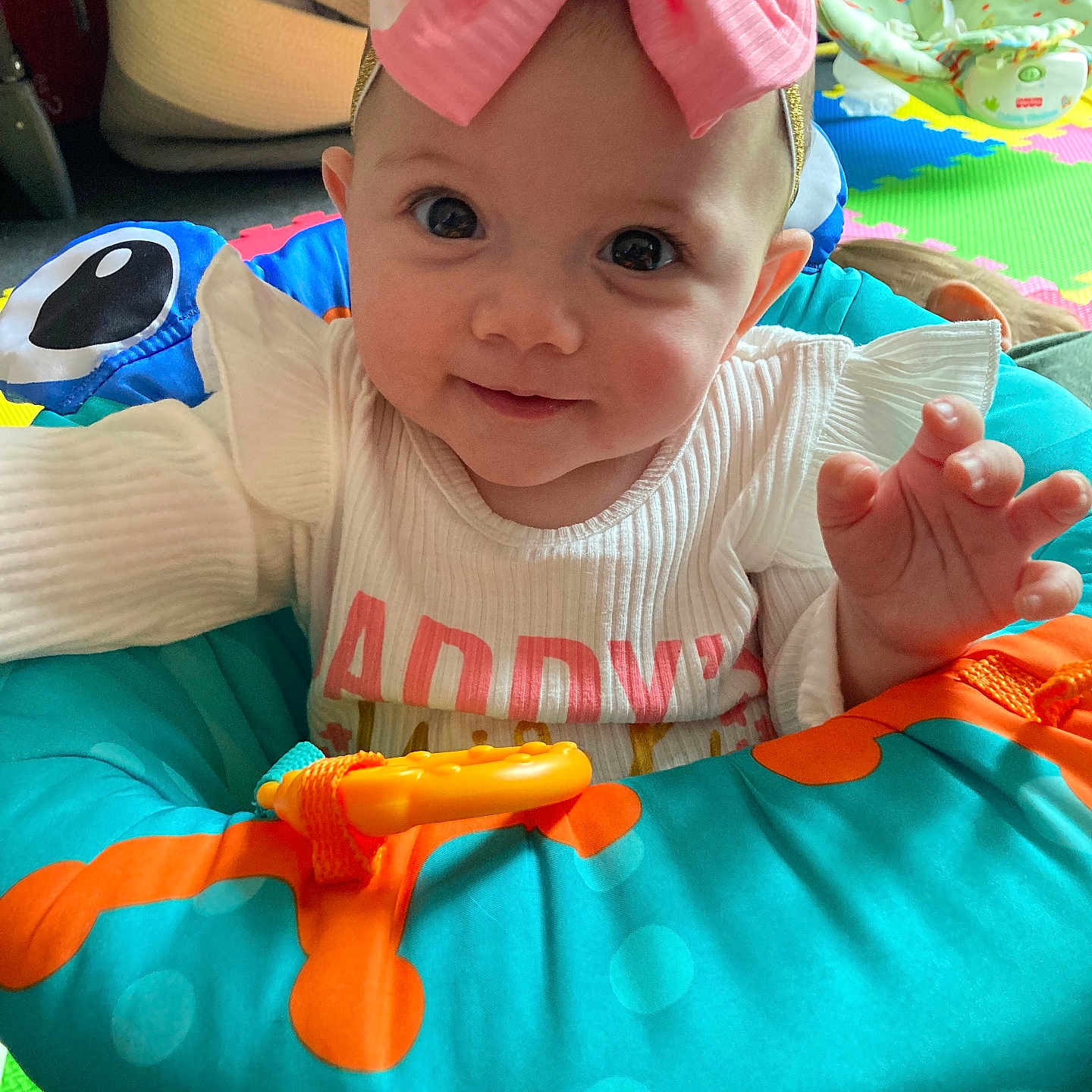 Hadley is registered to the contest to win money with this photo: accessories, baby, bodypart, cap, clothing, costume, cushion, face, finger, furniture, hand, hat, head, homedecor, person, photography, portrait, quilt, t_shirt, toy