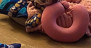 Cute is registered to the contest to win money with this photo: blanket, cozy, cute, dog, dog_bed, ear, floor, french_bulldog, indoor, pajamas, paw, pet, pink_pillow, relaxed, resting, sleepy, snout, soft, toy, wood_floor