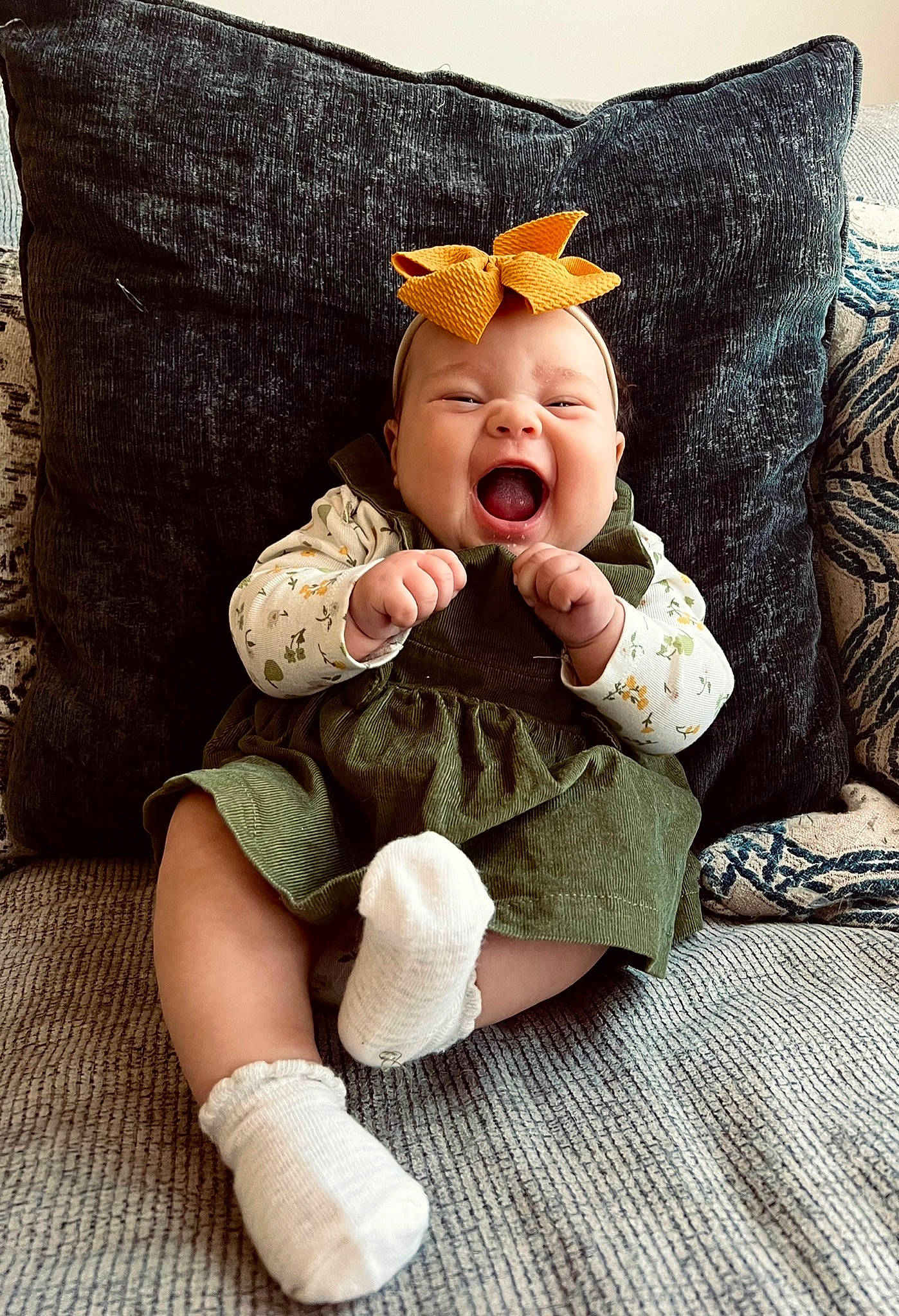 Haisleigh is registered to the contest to win money with this photo: baby, baby_sleeping, baby_toddler_clothing, comfort, costume_hat, couch, eye, face, fashion_accessory, foot, head, headband, linens, person, sitting, skin, sleeve, smile, sock, textile