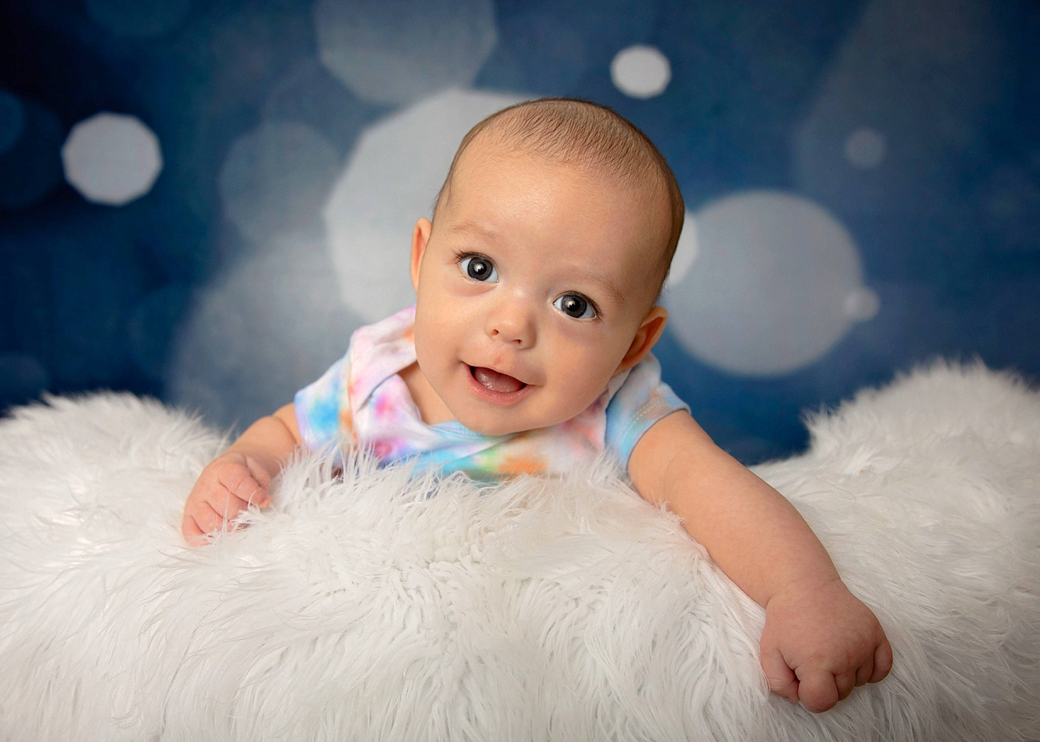 Brock is registered to the contest to win money with this photo: baby, baby_toddler_clothing, cheek, child, close_up, flash_photography, fun, fur, gesture, happy, iris, linens, people_in_nature, person, portrait_photography, room, sitting, skin, smile, toddler