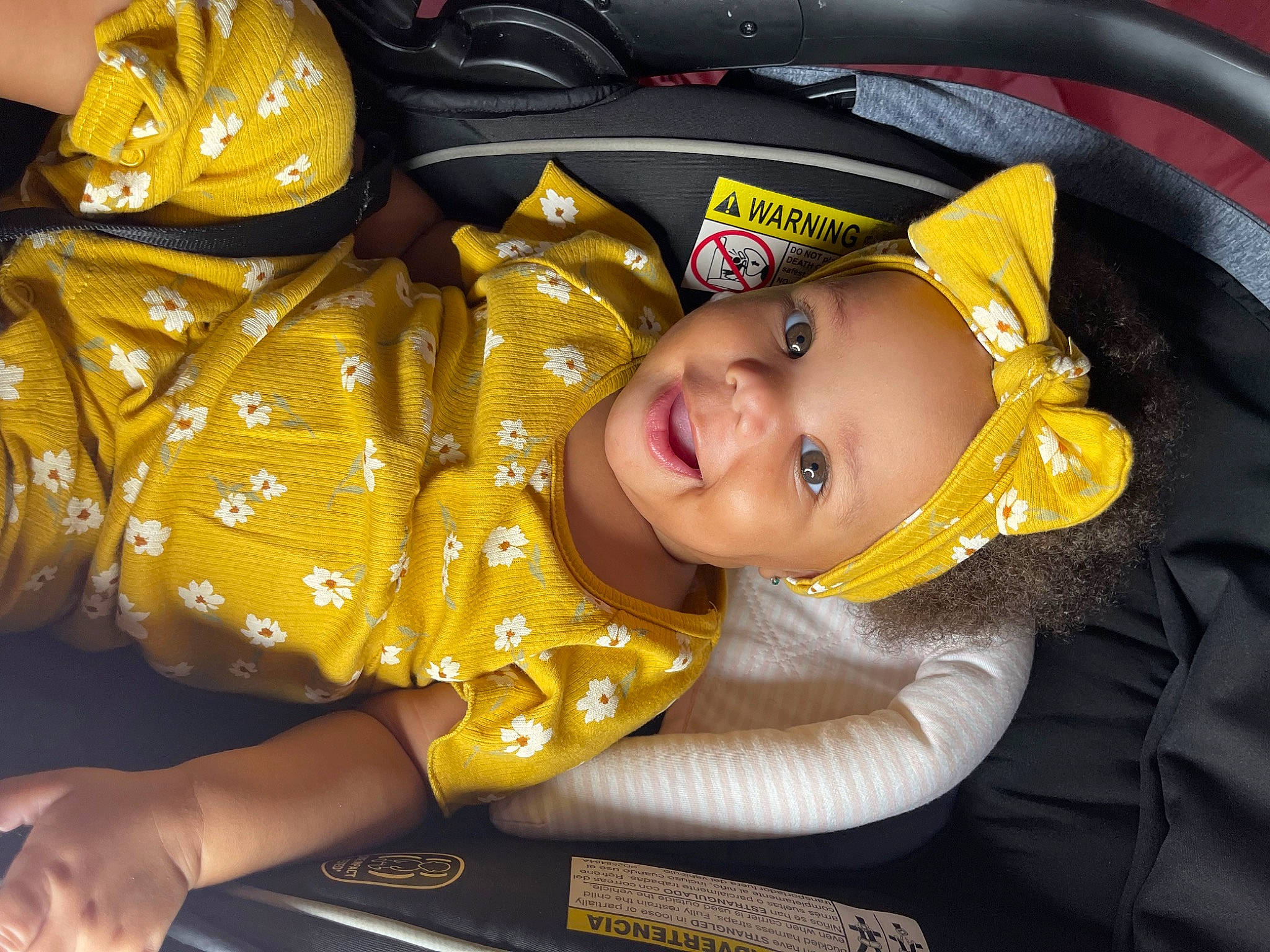 Naveah is registered to the contest to win money with this photo: auto_part, baby, baby_carriage, baby_products, baby_toddler_clothing, car_seat, child, comfort, fashion_accessory, fun, happy, hat, headgear, joy, motor_vehicle, outerwear, person, personal_protective_equipment, sleeve, smile