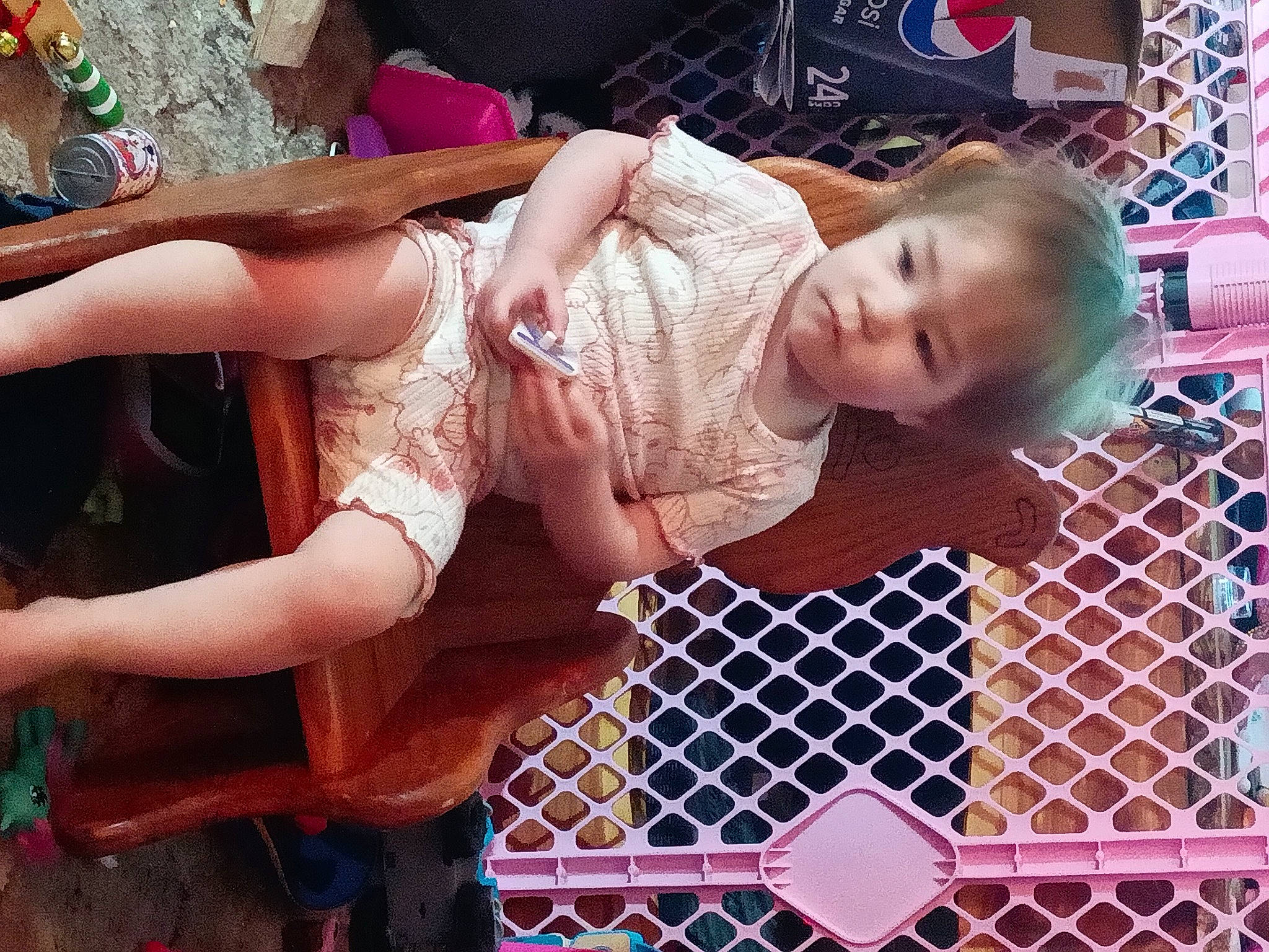 Rebekah is registered to the contest to win money with this photo: abdomen, baby, baby_products, baby_safety, baby_toddler_clothing, chest, child, elbow, fence, fun, human_leg, mesh, pattern, person, pink, skin, sunglasses, thigh, toddler, trunk