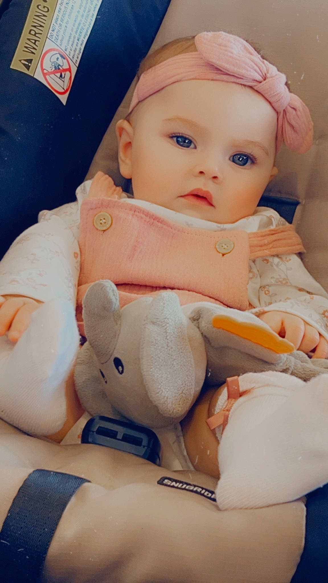 Athena is registered to the contest to win money with this photo: arm, baby, baby_products, baby_sleeping, baby_toddler_clothing, blue, cheek, child, comfort, doll, eyelash, head, headwear, human_body, linens, nail, person, pink, skin, toddler