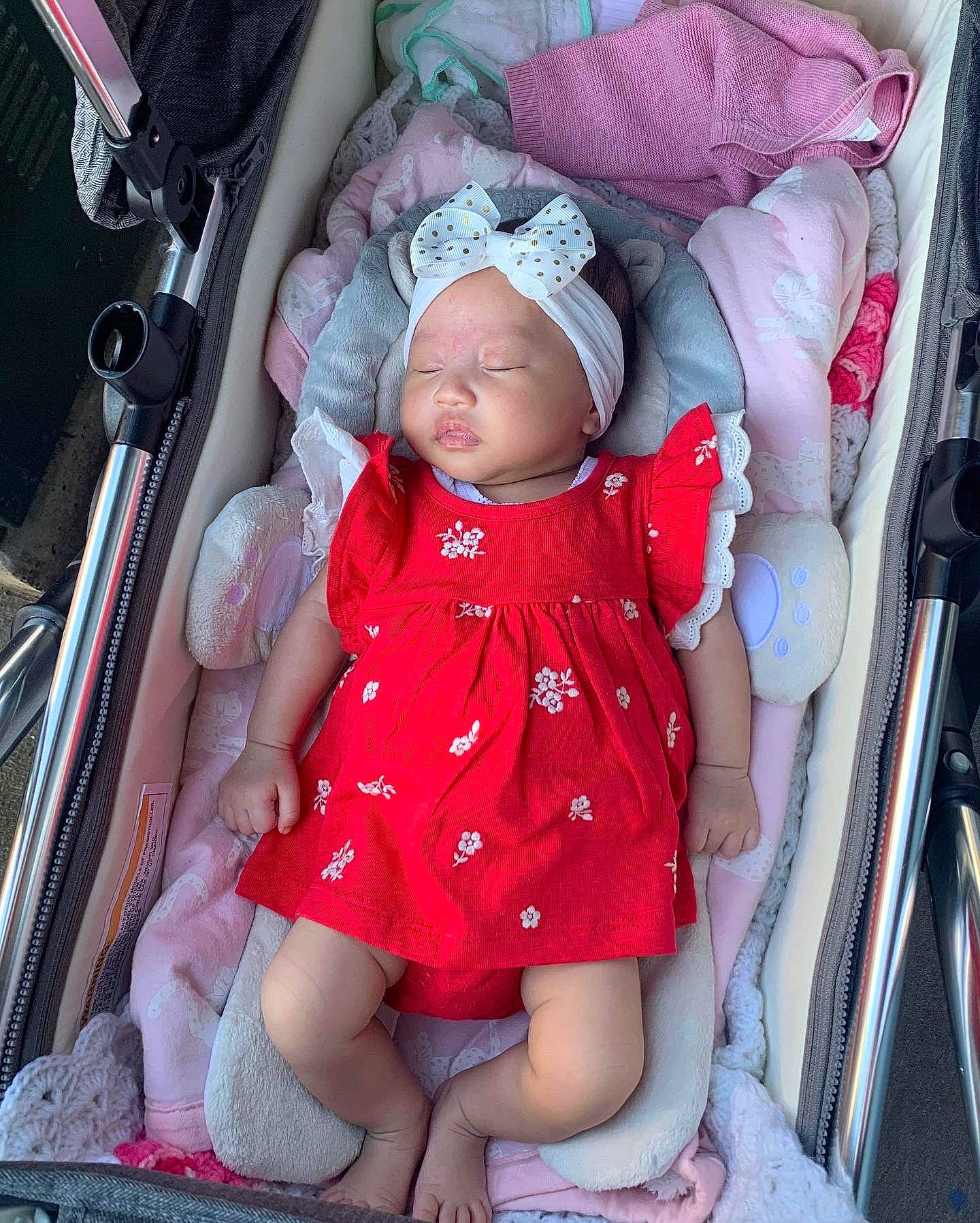 Genevieve joined the competition — help win amazing prizes! baby, baby_carriage, baby_products, baby_safety, baby_toddler_clothing, cheek, child, comfort, eye, lap, magenta, mouth, nail, person, pink, product, sitting, skin, thigh, thumb