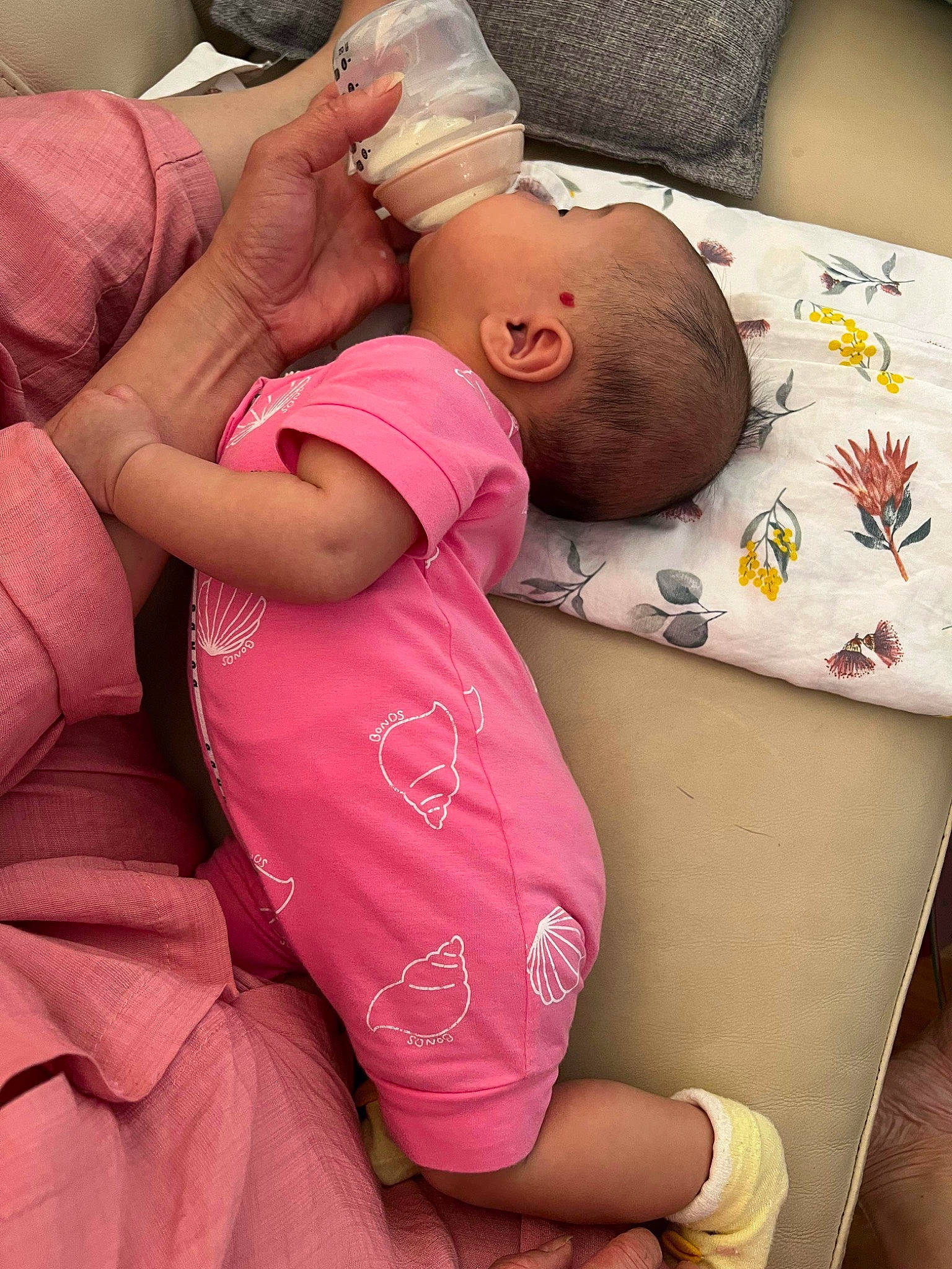 Genevieve is registered to the contest to win money with this photo: abdomen, baby, baby_products, baby_sleeping, baby_toddler_clothing, child, comfort, elbow, happy, hat, human_leg, linens, mouth, pattern, person, pink, room, skin, thigh, toddler