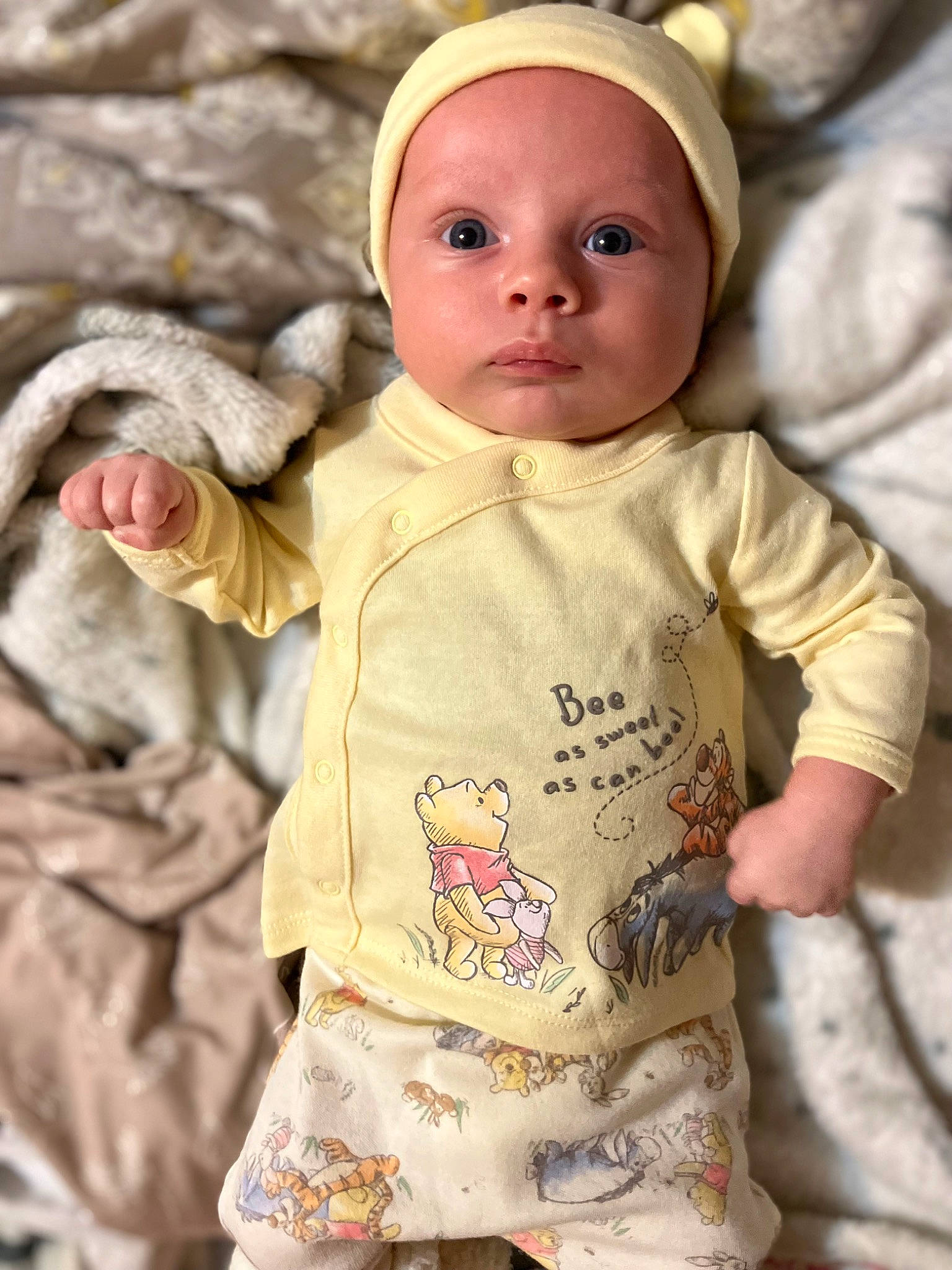 August joined the competition — help win amazing prizes! baby, baby_toddler_clothing, cap, cheek, child, eye, face, gesture, happy, lip, nose, organ, outerwear, person, photograph, sitting, skin, sleeve, t_shirt, toddler