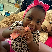 Kehanli joined the competition — help win amazing prizes! baby, child, girl, headband, bow, leopard_print, pink_clothing, teddy_bear, bed, cuddly_toy, smiling, chewing, indoor, cozy, furniture, mirror, bottle, person, happy, cute