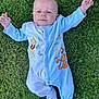 baby, blue_onesie, child, cute, face, feet, grass, hands, happy, infant, lying_down, nature, outdoor, playful, portrait, smiling, socks, sunlight, tigger, winnie_the_pooh