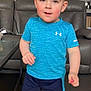 Mason joined the competition — help win amazing prizes! child, boy, indoor, blue_shirt, shorts, socks, carpet, couch, glass_table, living_room, curious_expression, walking, young_child, casual_clothing, short_hair, daylight, home, playful, shadow, person