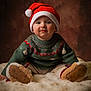 Vittorio a rejoint le concours — aidez-le/la à gagner de superbes lots ! baby, toddler, santa_hat, christmas_sweater, festive, portrait, studio_background, fur_blanket, cozy, smile, cheeks, boots, sitting, holiday, knitted, warm_lighting, cute, seasonal, child, indoor
