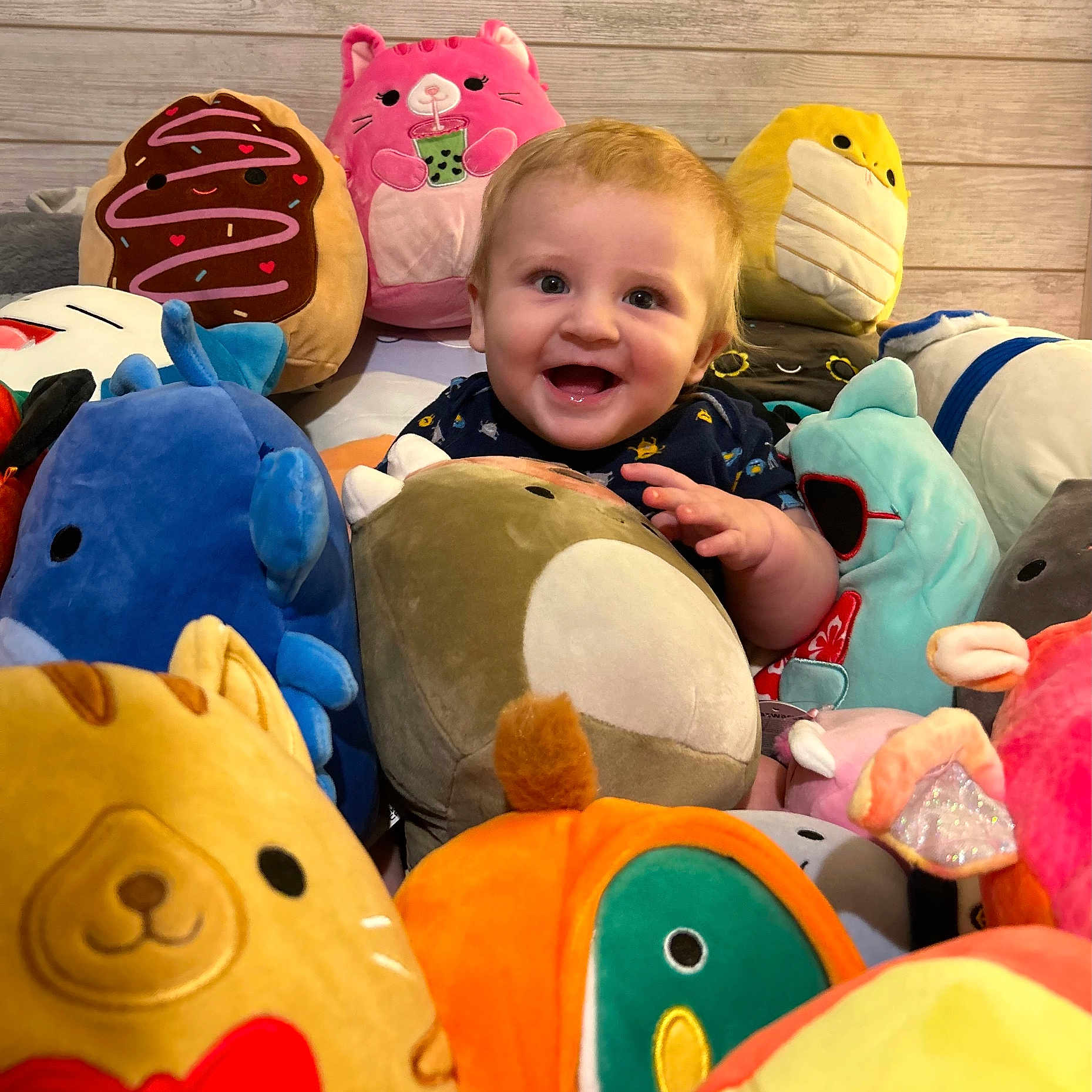 Milo joined the competition — help win amazing prizes! baby, ball, couch, cushion, face, football, furniture, happy, head, homedecor, laughing, person, photography, pillow, plush, portrait, soccer, soccerball, sport, toy