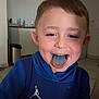 Timeo a rejoint le concours — aidez-le/la à gagner de superbes lots ! child, boy, blue_tongue, lollipop, smiling, hoodie, indoor, kitchen, tile_floor, young, happy, casual_clothing, playful, face, person, tongue, food, snack, short_hair, expression