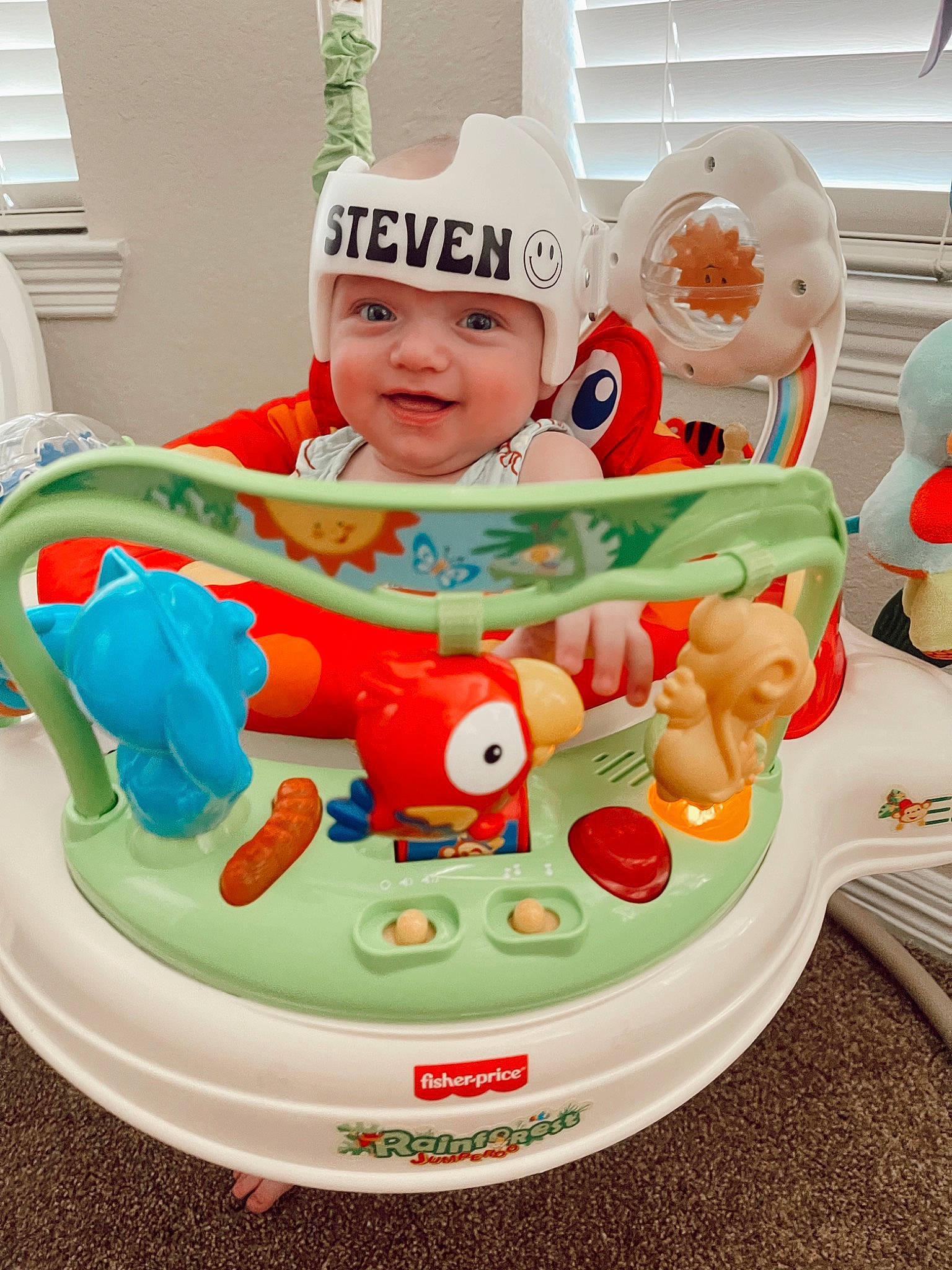 Steven is registered to the contest to win money with this photo: baby, baby_playing_with_toys, baby_products, baby_safety, baby_toddler_clothing, baby_toys, chair, child, event, fictional_character, fun, happy, headwear, joy, person, plastic, play, product, recreation, room