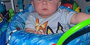 Kingston is registered to the contest to win money with this photo: baby, child, infant, blue, toy, activity_center, wide_eyes, curious, indoor, spiky_hair, colorful, plastic, seat, play, cute, person, portrait, expression, young, clothing