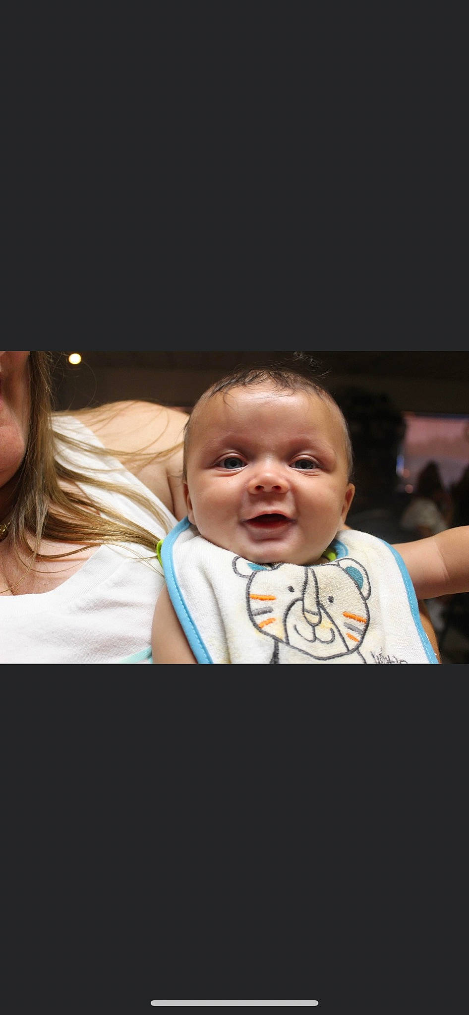 Darion is registered to the contest to win money with this photo: baby, baby_toddler_clothing, cheek, chin, darkness, ear, event, eyebrow, eyelash, flash_photography, fun, gesture, happy, iris, monochrome_photography, mouth, nose, person, room, t_shirt