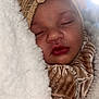 baby, blanket, bow, child, closeup, clothing, cozy, cute, face, golden, hand, headband, indoors, infant, peaceful, portrait, sleeping, soft, velvet, warm