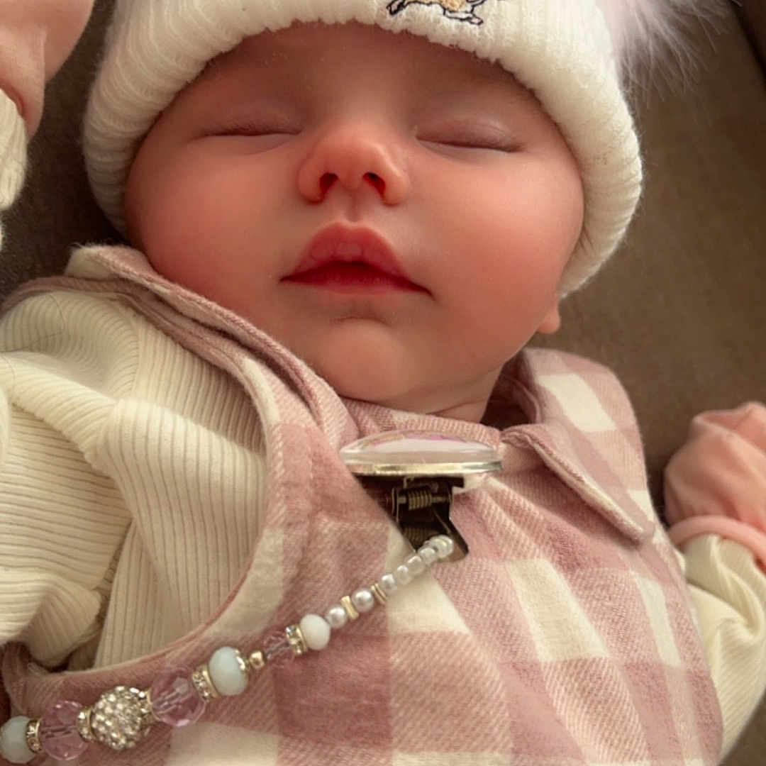Lynaida is registered to the contest to win money with this photo: accessories, baby, beanie, bonnet, cap, clothing, coat, face, glove, hat, head, hood, jacket, jewelry, necklace, newborn, person, photography, portrait, sleeping
