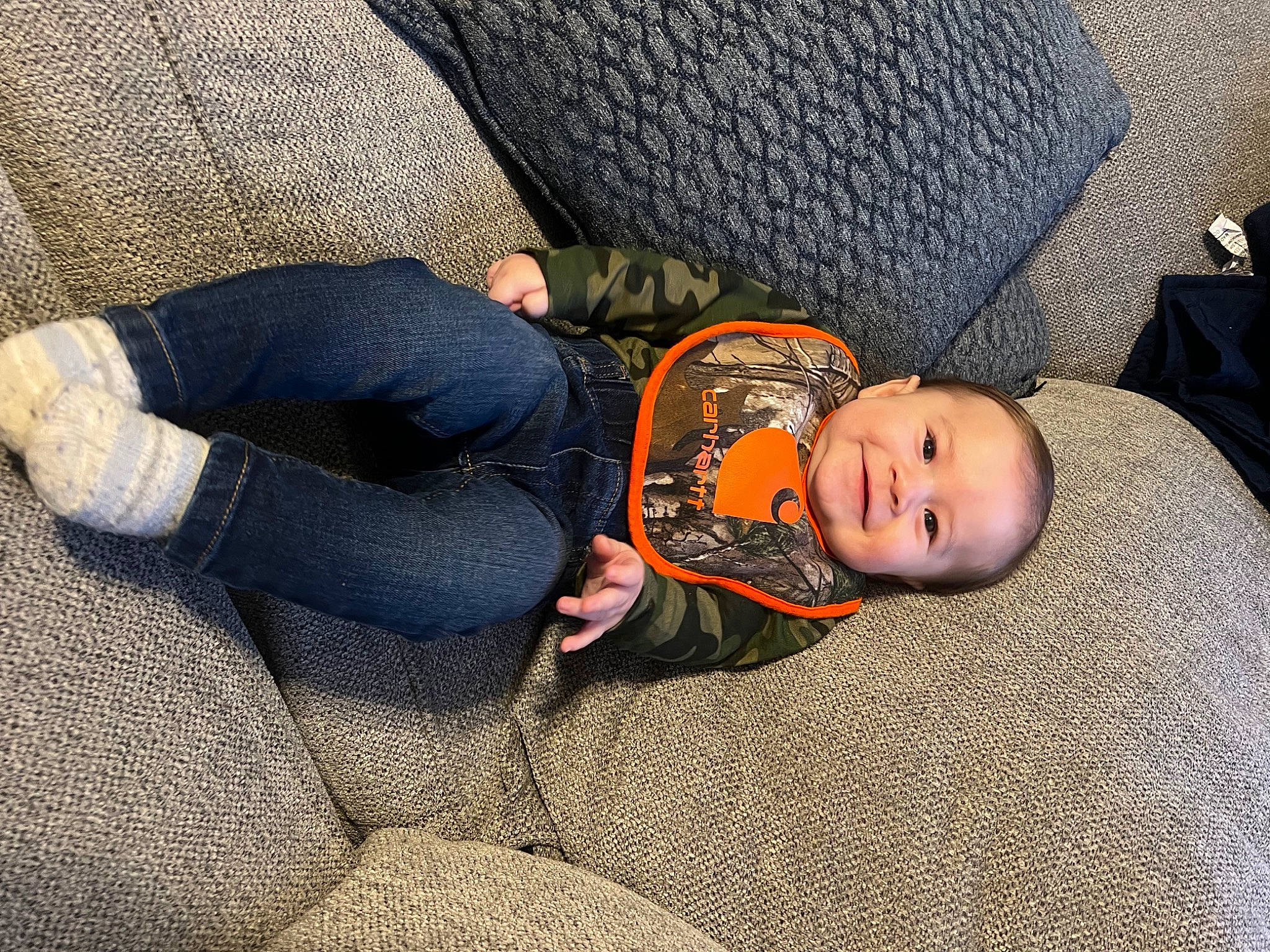 Waylynn is registered to the contest to win money with this photo: baby, baby_products, baby_toddler_clothing, bedtime, child, comfort, flooring, grass, grey, joy, lap, linens, mammal, nap, person, sitting, sleep, textile, toddler, tree