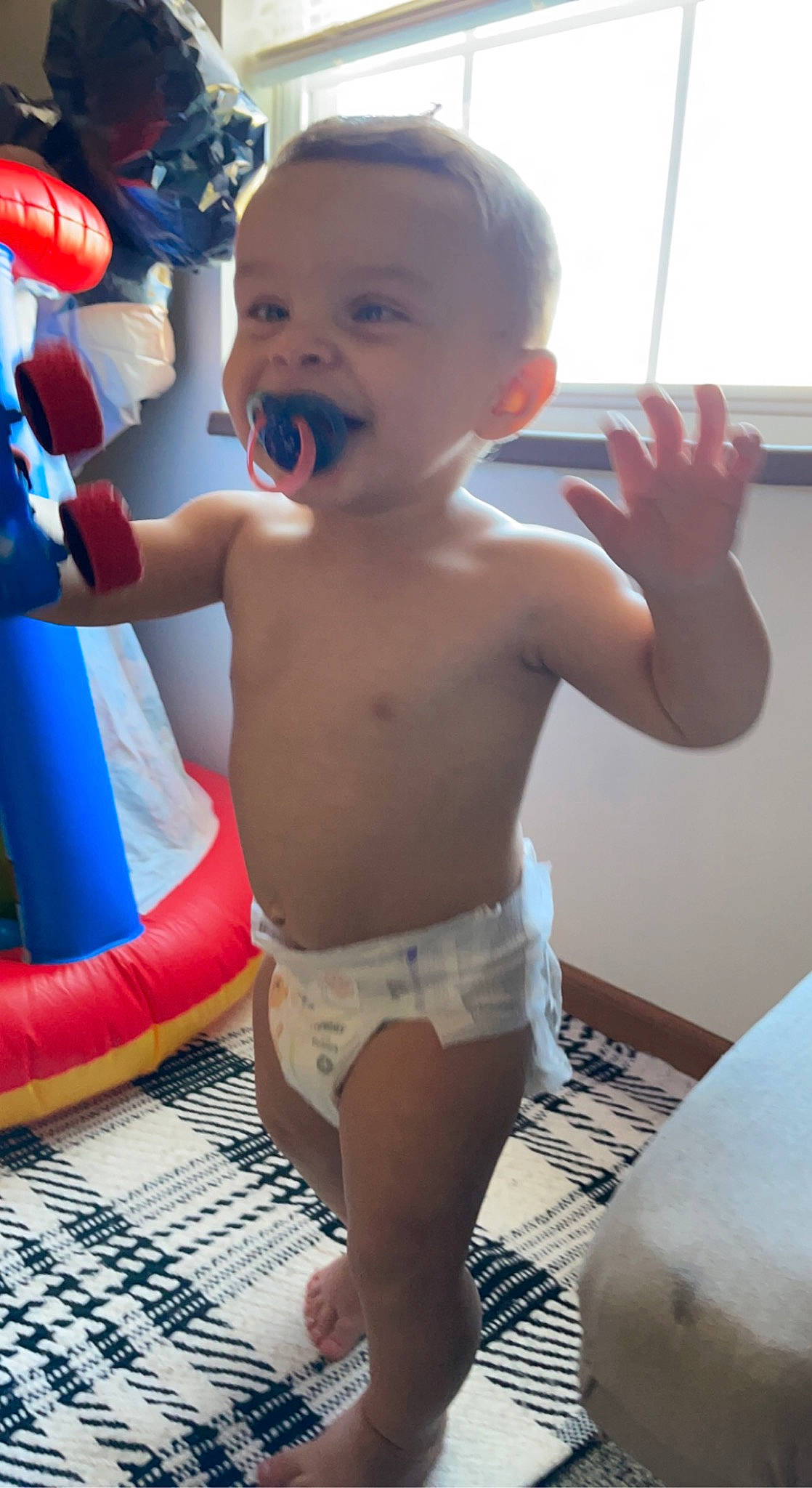 Greyson is registered to the contest to win money with this photo: baby, barechested, chest, child, finger, fun, gesture, happy, human_leg, knee, leisure, mouth, muscle, person, shorts, smile, thigh, thumb, toddler, trunk