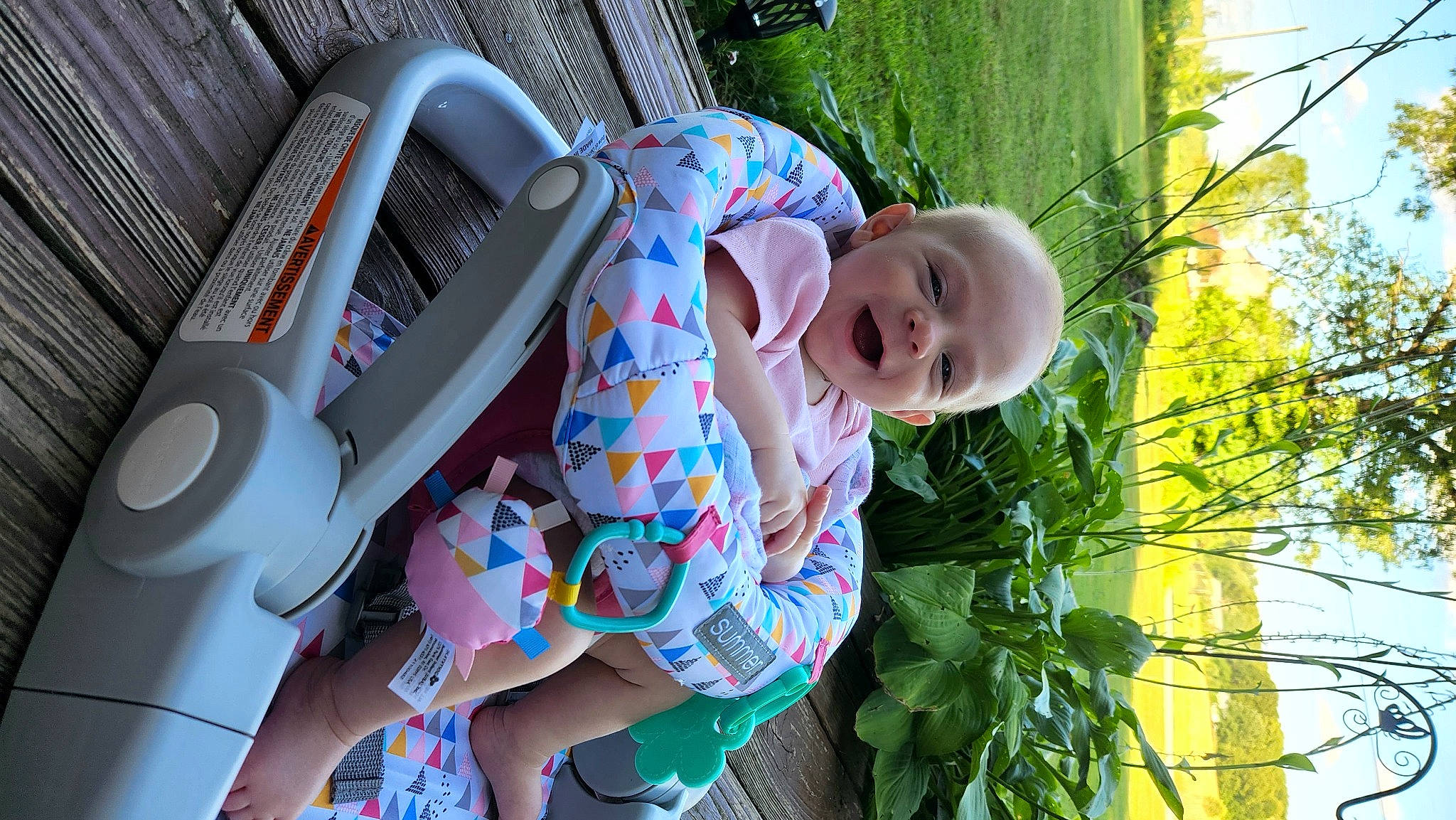 Collins joined the competition — help win amazing prizes! baby, baby_products, baby_toddler_clothing, car_seat, child, comfort, fun, grass, green, happy, hat, leisure, person, plant, sitting, smile, sneakers, steering_wheel, toddler, tree
