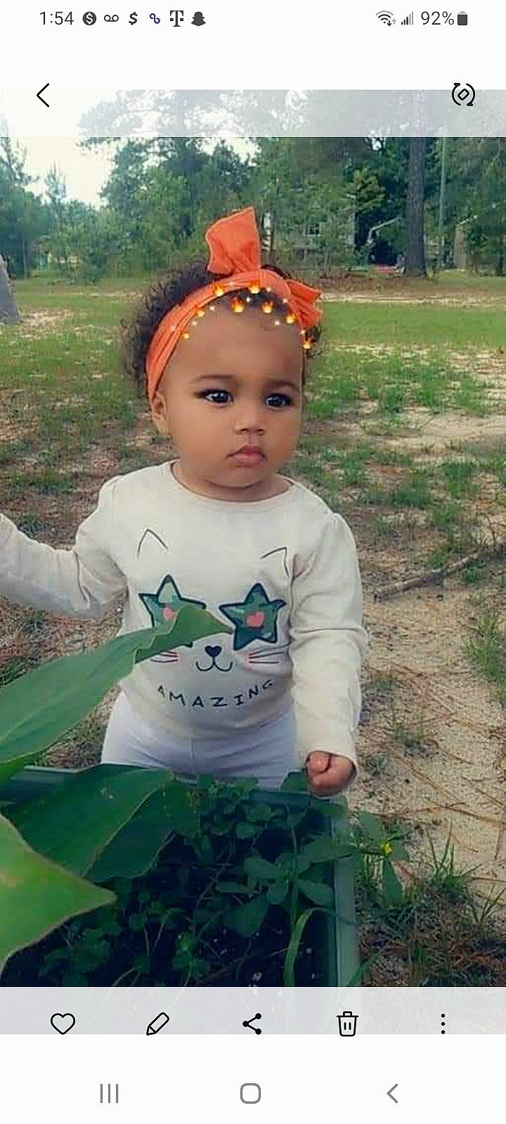 Shannon joined the competition — help win amazing prizes! baby, baby_toddler_clothing, child, eye, garden, grass, grass_family, grassland, happy, head, headband, leisure, people_in_nature, person, plant, recreation, sitting, sleeve, t_shirt, toddler