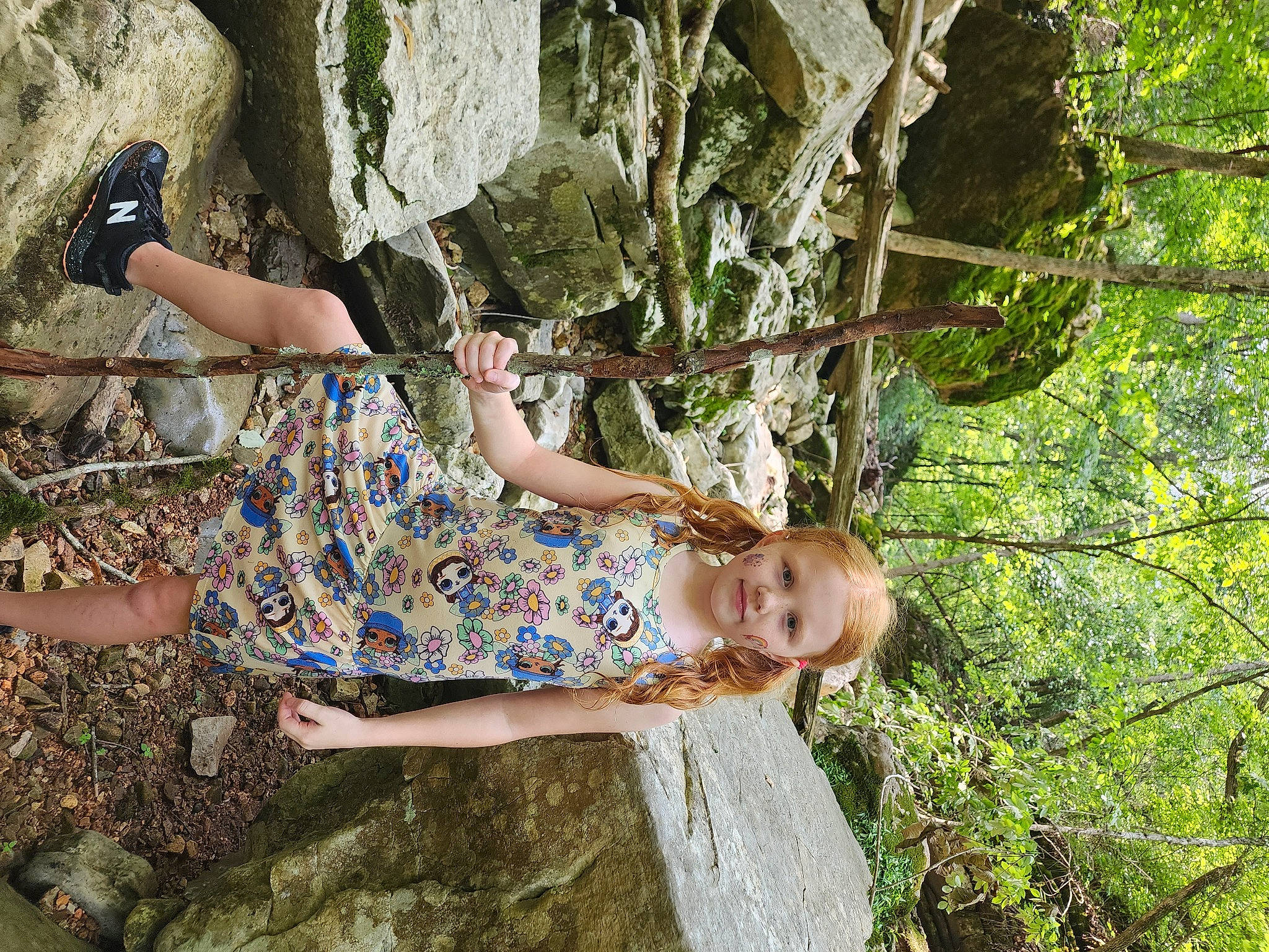 Natalie is registered to the contest to win money with this photo: adaptation, boot, day_dress, fawn, fun, grass, happy, human_body, human_leg, leg, leisure, people_in_nature, person, plant, sandal, sitting, thigh, tree, trunk, twig