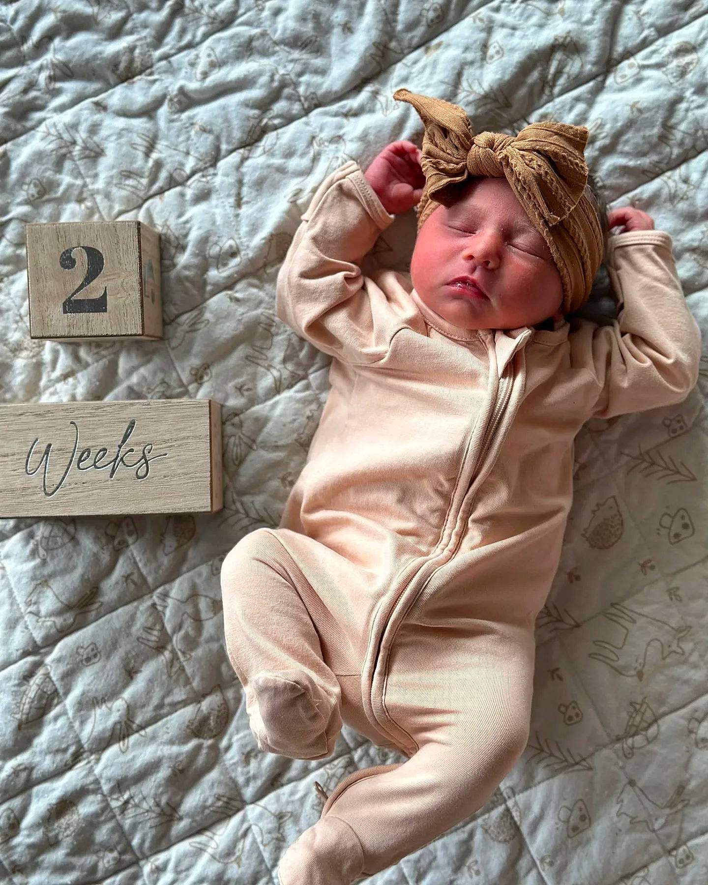 Ivy is registered to the contest to win money with this photo: bedding, brown_hair, comfort, eyewear, flooring, fur, gesture, grass, grey, happy, headwear, human_leg, knee, linens, pattern, person, room, sitting, sunglasses, textile