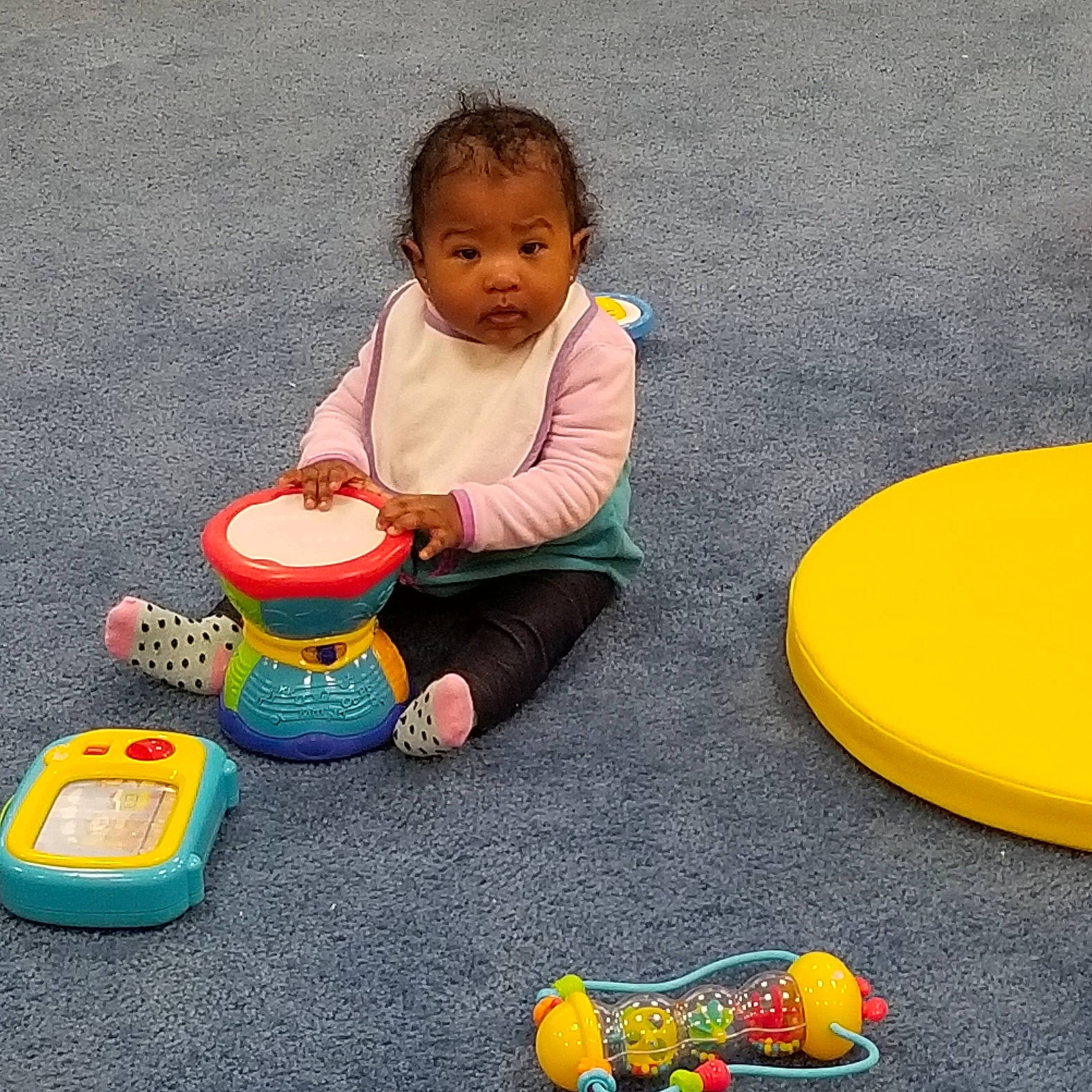 Cali joined the competition — help win amazing prizes! chair, child, fun, infant, person, plastic, play, product, sitting, table, toddler, toy, yellow