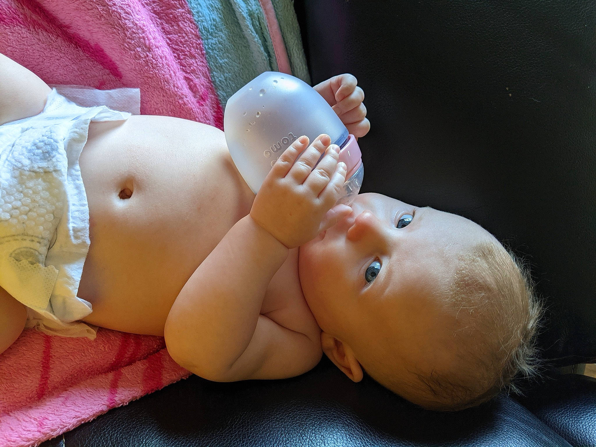 Cora is registered to the contest to win money with this photo: arm, baby, cheek, comfort, eye, finger, gesture, hand, head, human_body, joint, leg, lip, mouth, muscle, neck, nose, person, skin, stomach