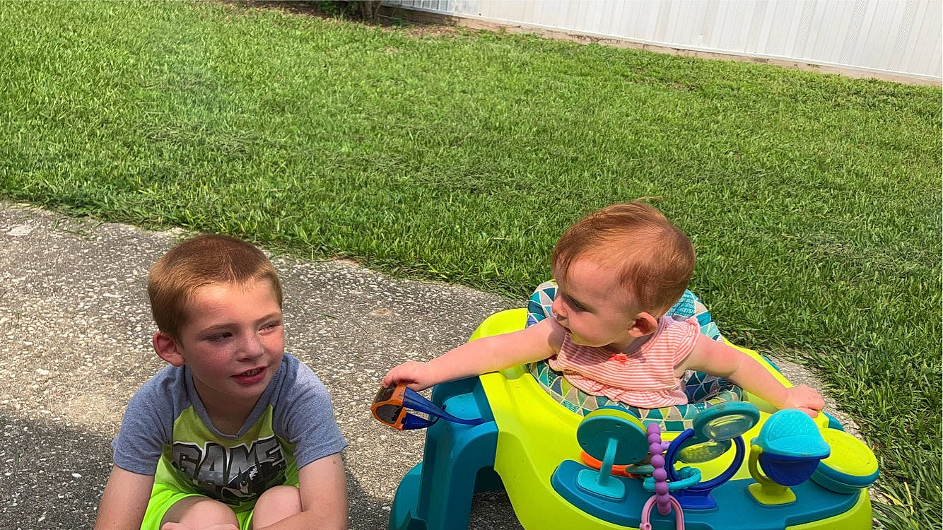 Justin joined the competition — help win amazing prizes! baby, baby_toddler_clothing, child, fun, garden, grass, green, happy, joy, lawn, leaf, leisure, people_in_nature, person, recreation, shorts, sitting, spring, summer, t_shirt