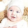 Lyam participe au concours pour gagner de l'argent avec cette photo : baby, infant, smile, face, knit_hat, pom_pom, white_clothing, crocheted_blanket, beige, close_up, happy, child, soft_lighting, portrait, cute, cozy, warm, indoors, skin, person