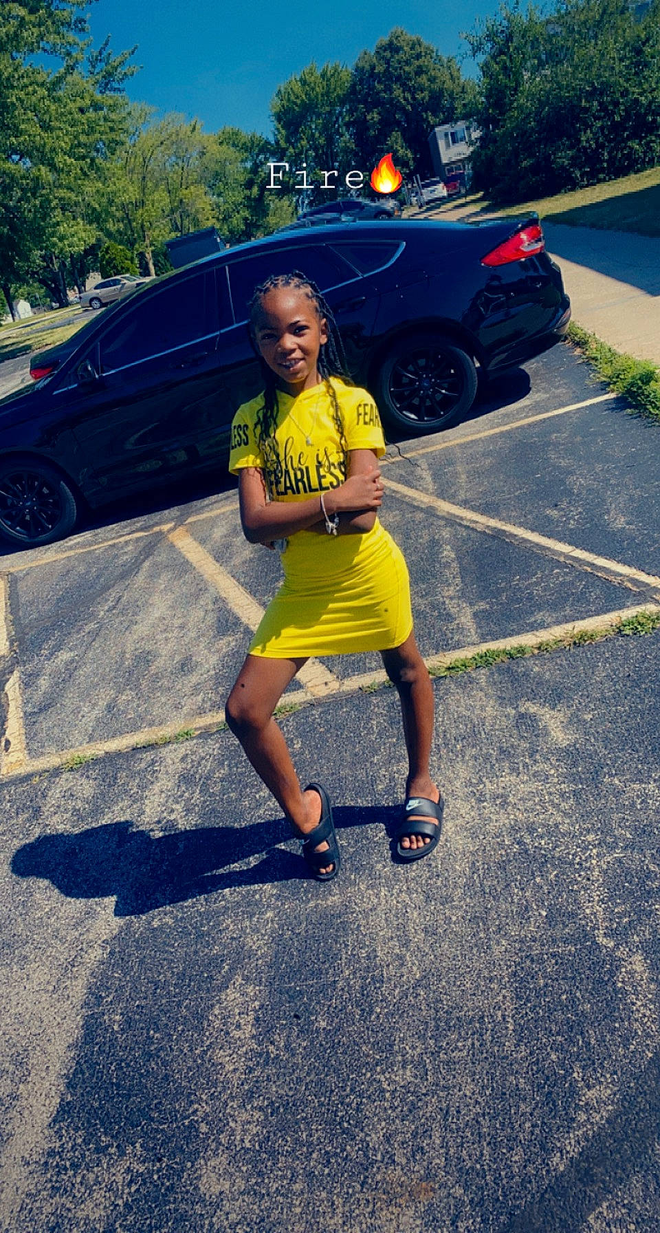 Brooklyn is registered to the contest to win money with this photo: asphalt, automotive_design, automotive_exterior, automotive_lighting, automotive_tire, bumper, car, dress, happy, hood, joy, land_vehicle, motor_vehicle, person, plant, road_surface, tints_and_shades, tire, tree, vehicle