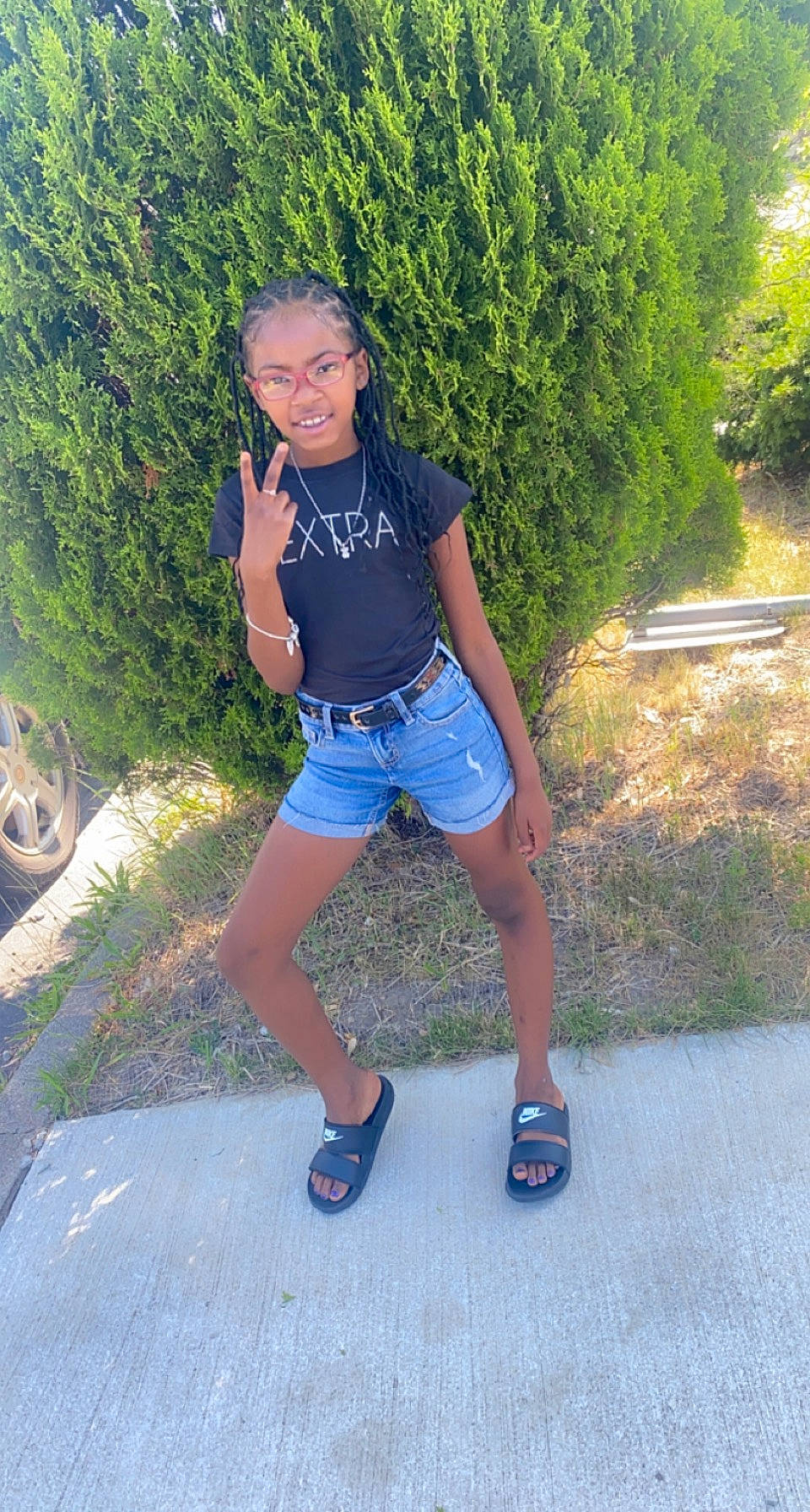 Brooklyn is registered to the contest to win money with this photo: asphalt, black_hair, cool, denim, flash_photography, footwear, grass, happy, knee, leg, leisure, person, plant, shoe, shorts, smile, sneakers, sportswear, t_shirt, thigh