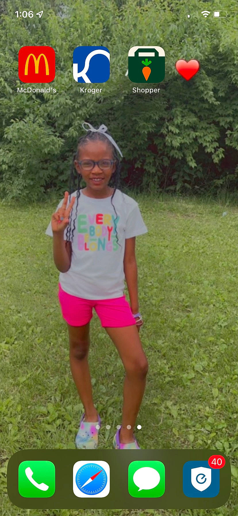 Brooklyn is registered to the contest to win money with this photo: clothing, cool, fun, grass, grassland, happy, joy, knee, leisure, magenta, meadow, nature, people_in_nature, person, pink, plant, recreation, shorts, sleeve, t_shirt