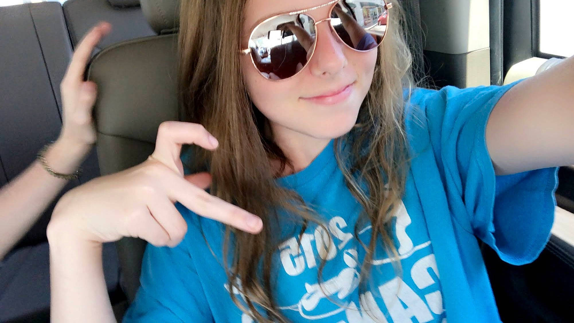 Halie joined the competition — help win amazing prizes! arm, blue, eyewear, face, finger, gesture, glasses, goggles, hairstyle, hand, happy, joint, joy, lip, mouth, person, photograph, shoulder, sleeve, smile