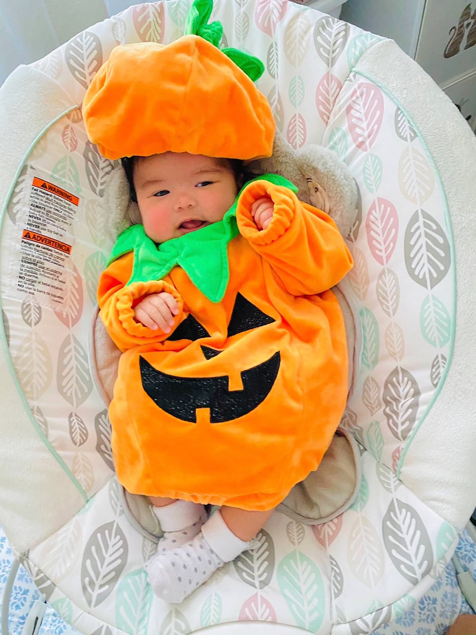 Luna Maxine is registered to the contest to win money with this photo: baby, baby_toddler_clothing, child, headwear, orange, outerwear, person, pumpkin, smile, toddler