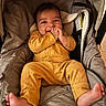 Journey joined the competition — help win amazing prizes! baby, infant, smile, yellow_clothing, baby_carrier, cushion, hands, feet, happy, portrait, indoor, child, cute, cozy, person, seat, clothing, face, newborn, resting
