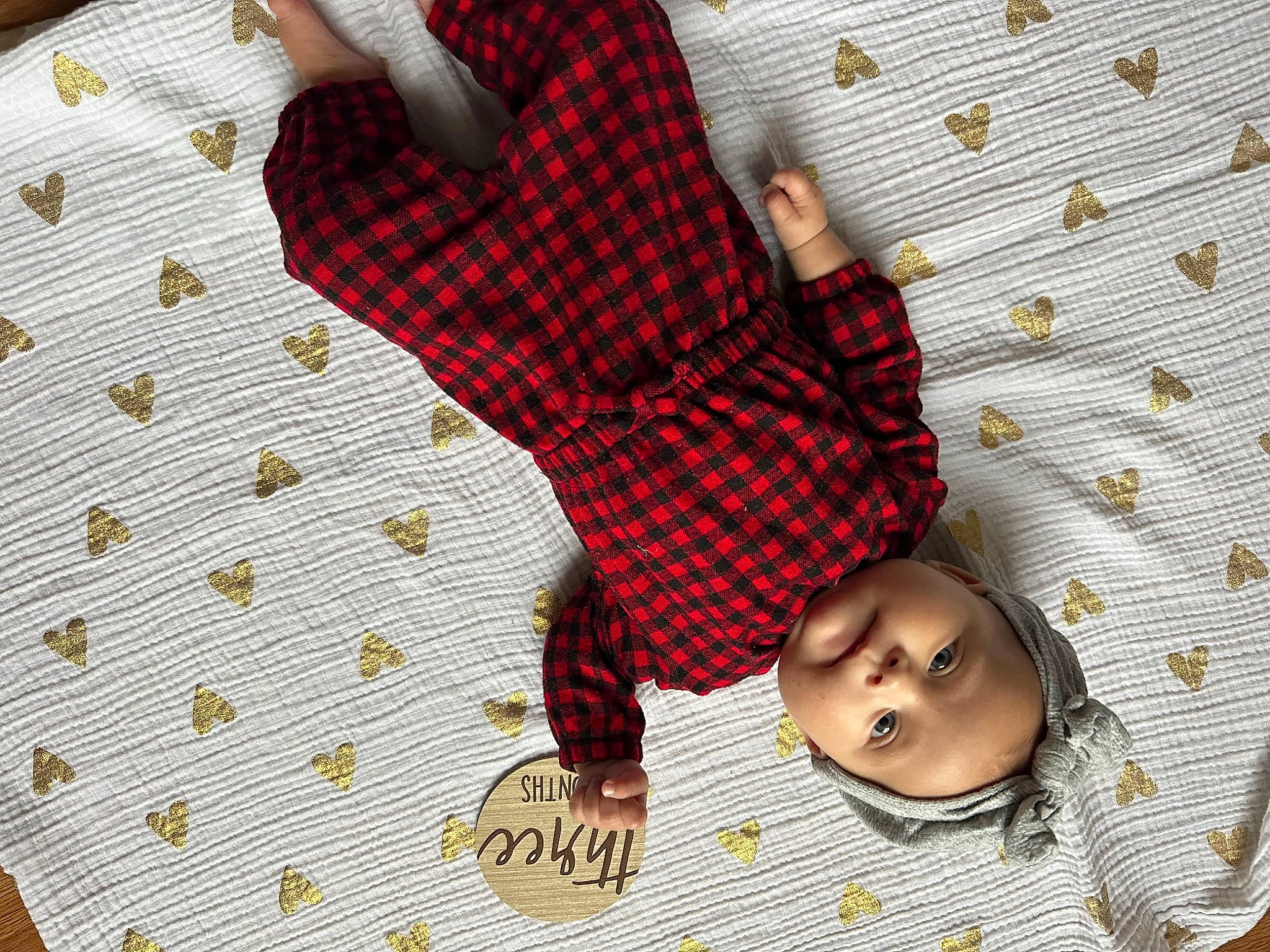Avery joined the competition — help win amazing prizes! baby, baby_products, baby_toddler_clothing, bed_sheet, bedding, child, comfort, floor, flooring, happy, human_leg, linens, pattern, person, plaid, room, sleeve, tartan, textile, toddler