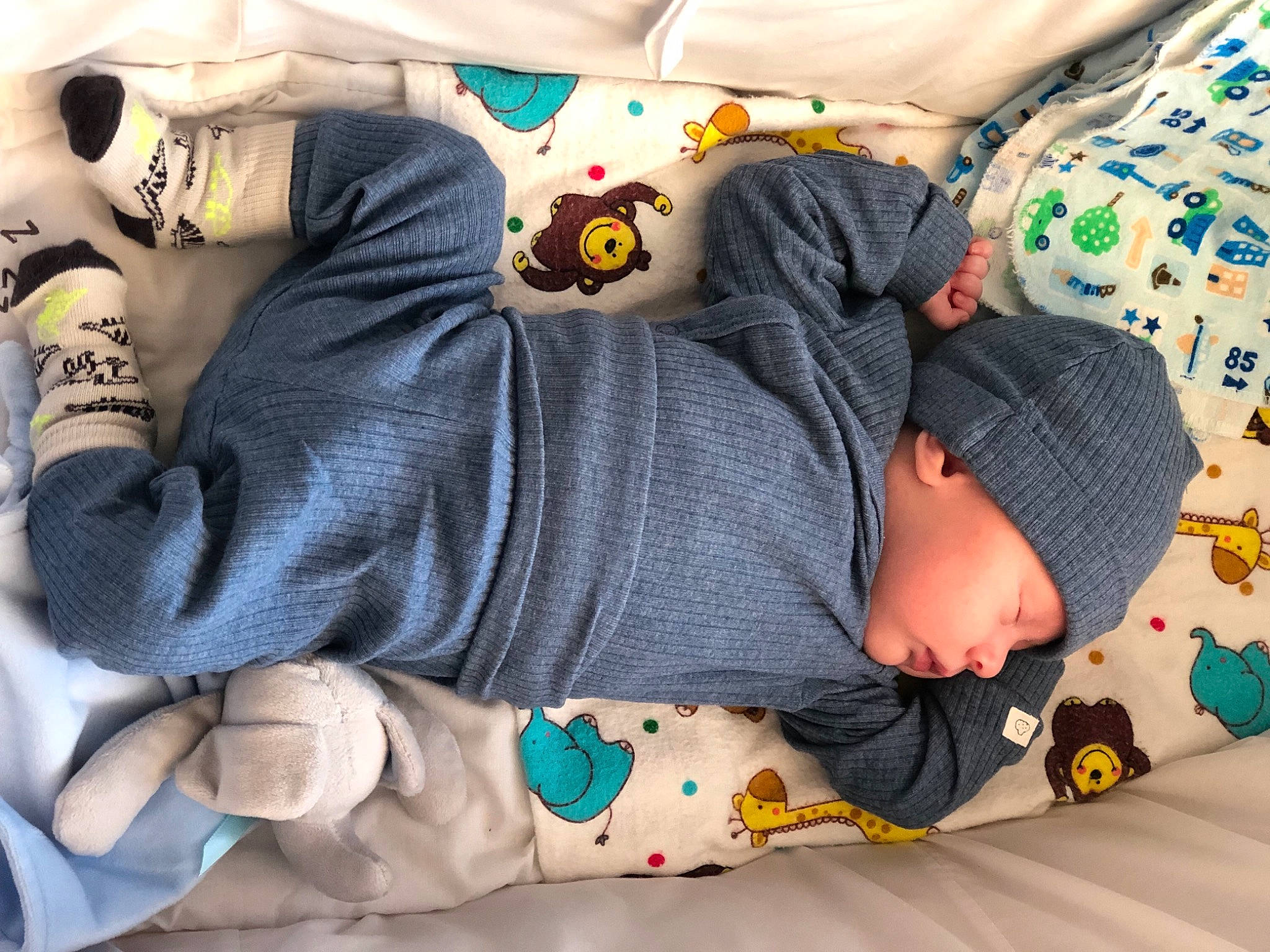 Kian joined the competition — help win amazing prizes! arm, baby, baby_products, baby_sleeping, baby_toddler_clothing, child, comfort, green, grey, head, headwear, human_body, linens, pattern, person, photograph, product, sleeve, textile, toddler