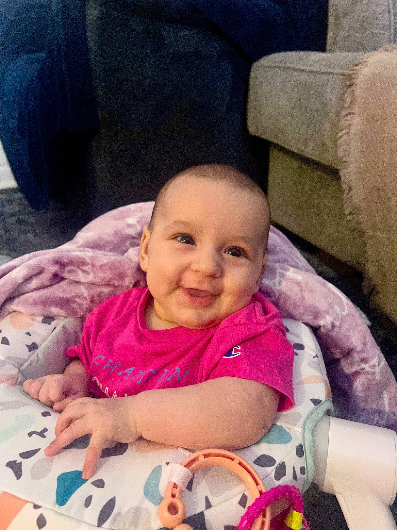 Aspen is registered to the contest to win money with this photo: baby, baby_carriage, baby_products, baby_toddler_clothing, cheek, comfort, face, happy, head, joy, lap, mammal, mouth, person, pink, product, purple, skin, smile, textile