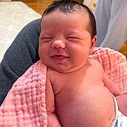 Lillian joined the competition — help win amazing prizes! baby, infant, newborn, blanket, pink, smile, happy, skin, diaper, cute, person, indoors, child, face, hair, arm, torso, soft, comfort, joy