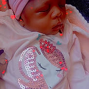 Royalynn joined the competition — help win amazing prizes! baby, sleeping, headband, pink, unicorn, sequins, white_clothing, blanket, cozy, infant, cute, peaceful, portrait, child, indoor, soft_lighting, red_hearts, closeup, young_child, adorable