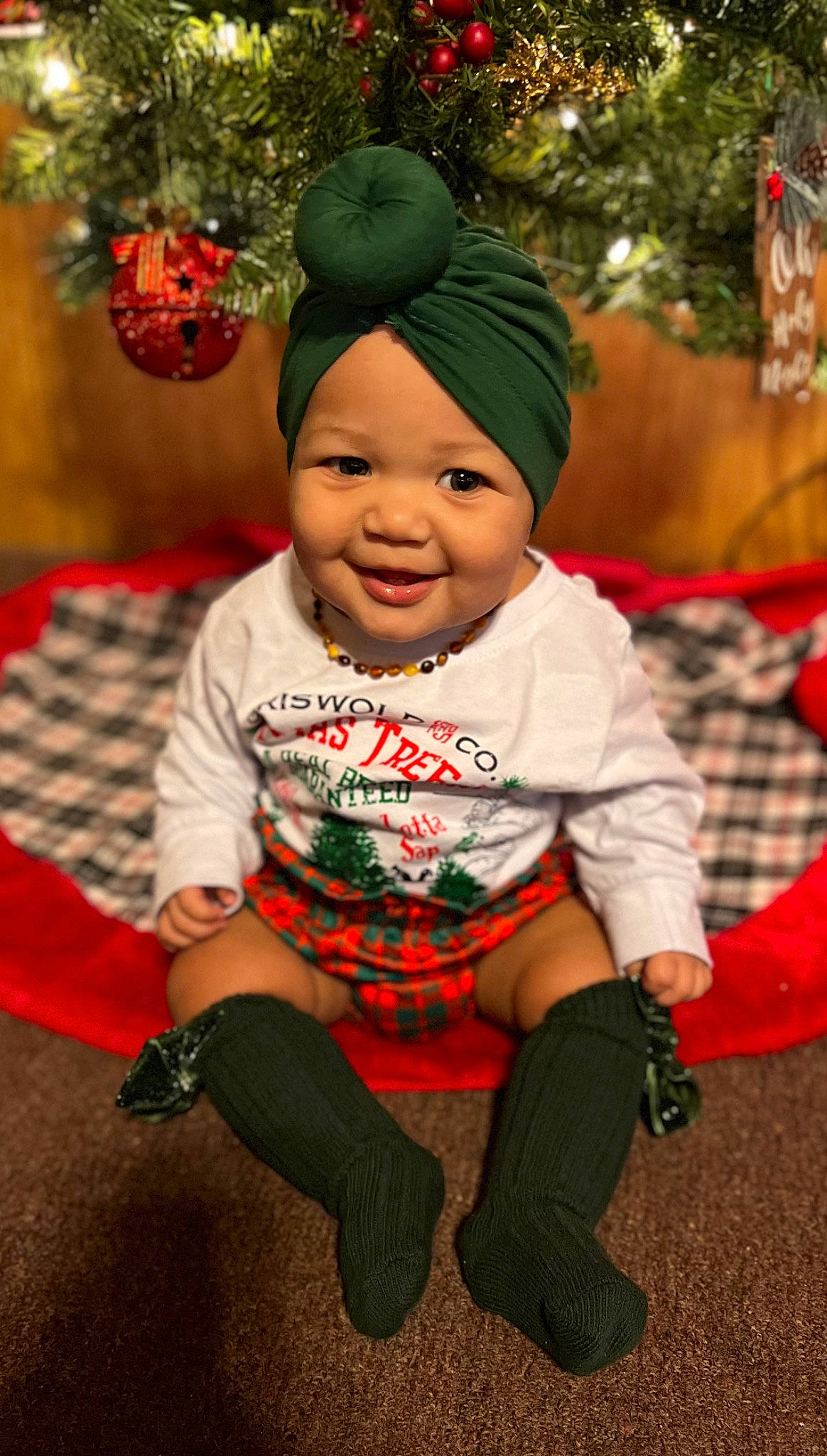 Gracelynn joined the competition — help win amazing prizes! baby, baby_toddler_clothing, cap, child, christmas, christmas_eve, costume_hat, event, fictional_character, fun, grass, happy, headwear, holiday, joy, leaf, person, plant, sleeve, smile